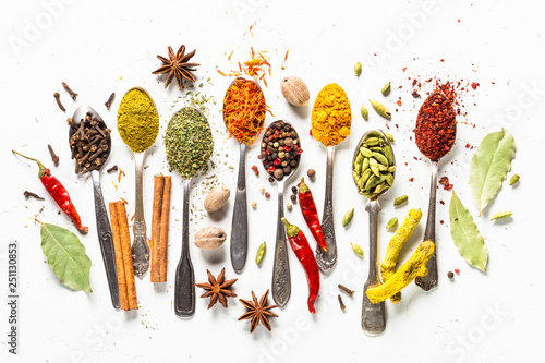 Fototapeta Naklejka Na Ścianę i Meble -  Set of various spices in spoons on white