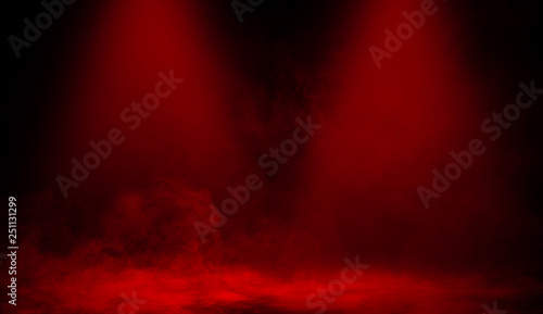 Red smoke stage studio. Abstract spotlight with fog texture .