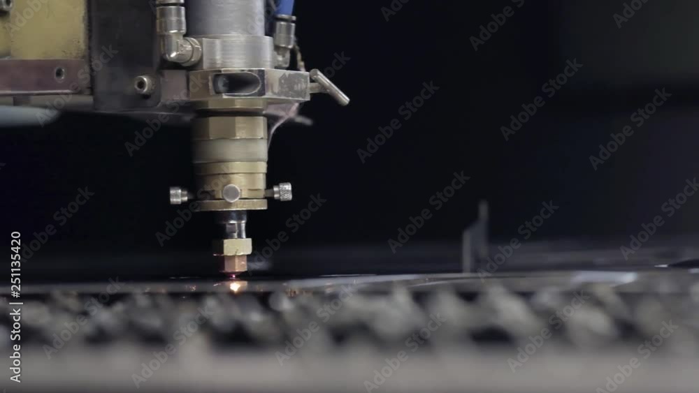 Cut sheet metal at workshop. Modern tool in heavy industry. Dangerous job. High precision manufacture of steel parts. CNC Laser cutting of metal, modern industrial machine. Small depth of field. Cut sheet metal at workshop. Modern tool in heavy industry. Dangerous job. High precision manufacture of steel parts. CNC Laser cutting of metal, modern industrial machine. Small depth of field.