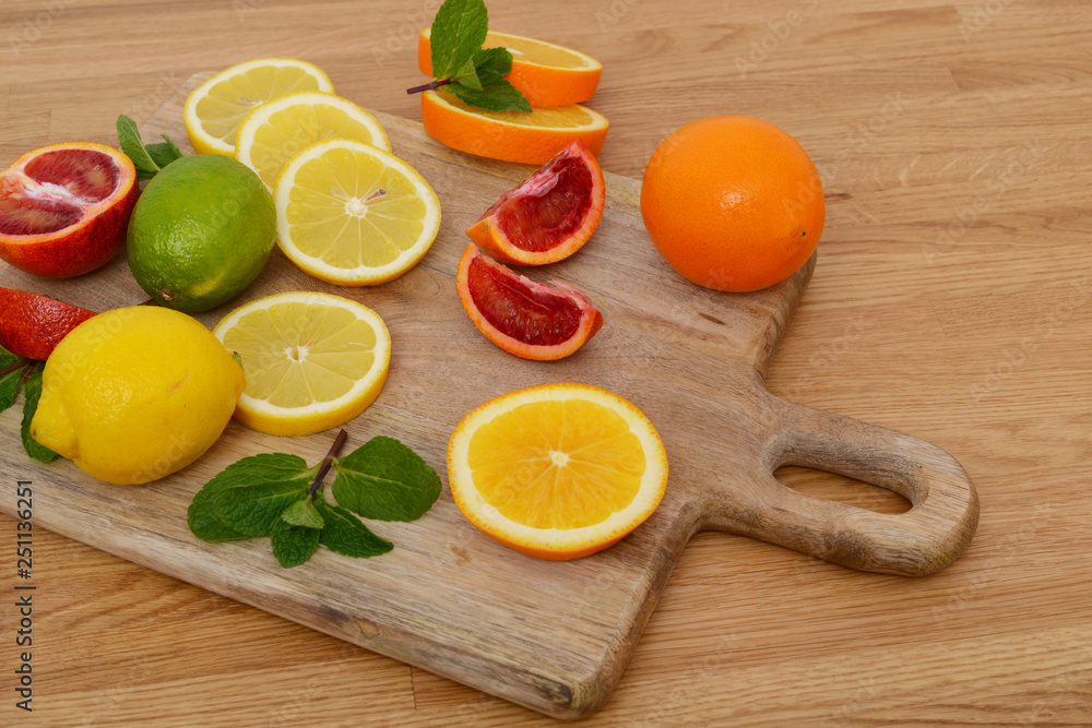 Mix citrus fresh fruit on the wooden table Mix citrus fresh fruit on the wooden table
