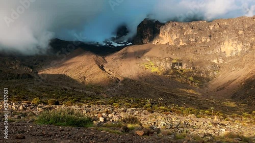 Timelapse of clouds around Mount Kilimanjaro during sunset photo