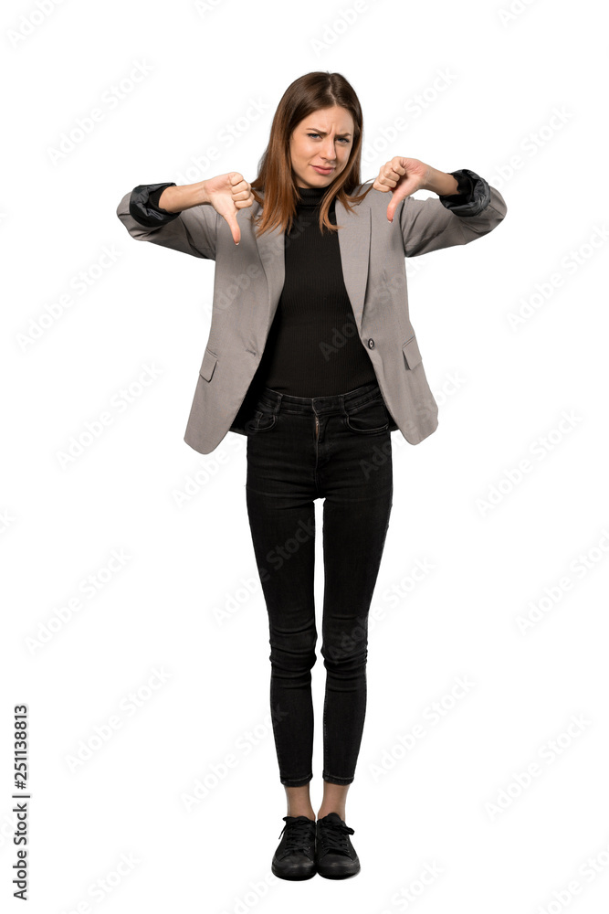 A full-length shot of a Business woman showing thumb down over isolated white background A full-length shot of a Business woman showing thumb down over isolated white background