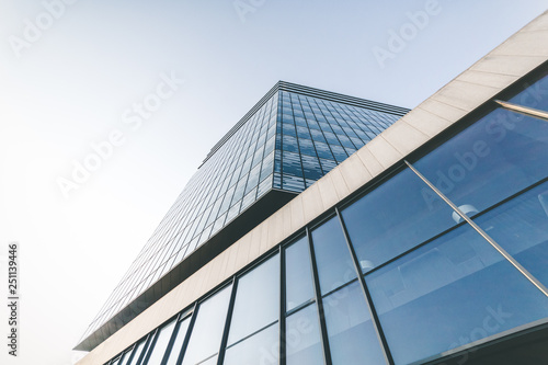 Big blue glass building from the bottom