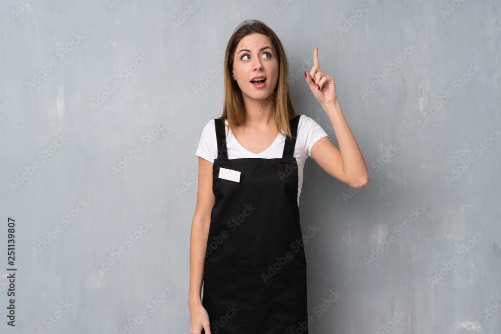 Employee woman intending to realizes the solution while lifting a finger up Employee woman intending to realizes the solution while lifting a finger up