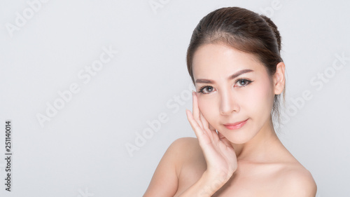 Beautiful Young Woman(Asian girl 20-25 years old) with clean fresh skin in the mobile product sample box.