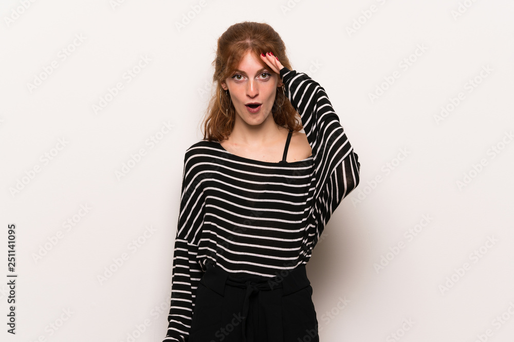 Young redhead woman over white wall has just realized something and has intending the solution Young redhead woman over white wall has just realized something and has intending the solution