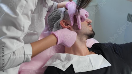 the doctor makes contouring a man