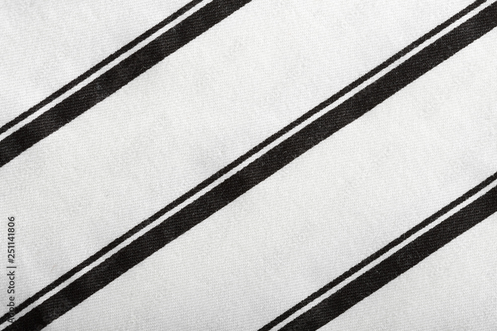Fototapeta premium Black and white striped cotton fabric. The texture of cotton fabric.