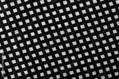 Fragment of black and white fabric. Plaid cotton fabric background