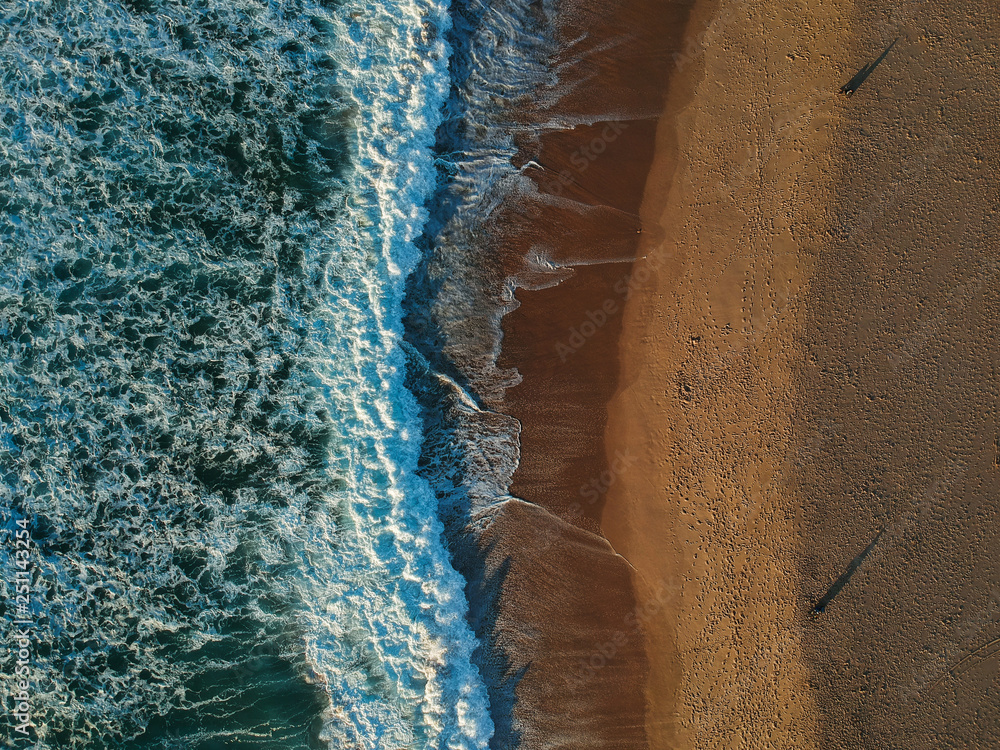 Aerial view of sandy beach with waves and clear ocean water. Drone photo Aerial view of sandy beach with waves and clear ocean water. Drone photo