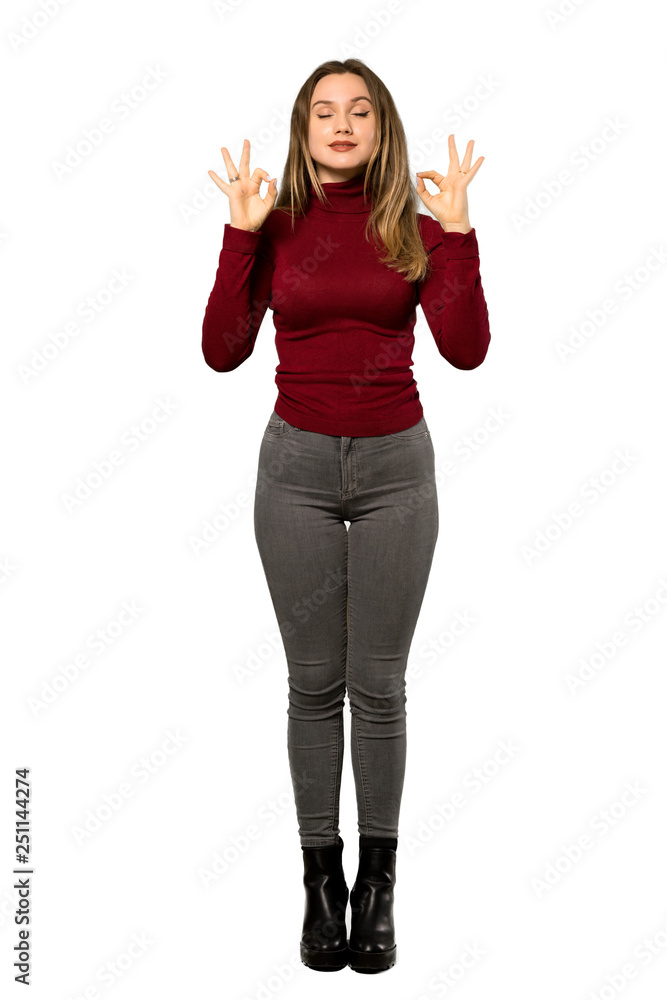 A full-length shot of a Teenager girl with turtleneck in zen pose over isolated white background A full-length shot of a Teenager girl with turtleneck in zen pose over isolated white background