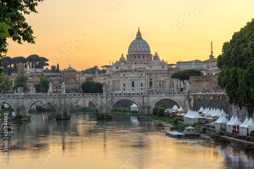 Sunset Panorama of Tiber River, St. Angelo Bridge and St. Peter's Basilica in Rome, Italy