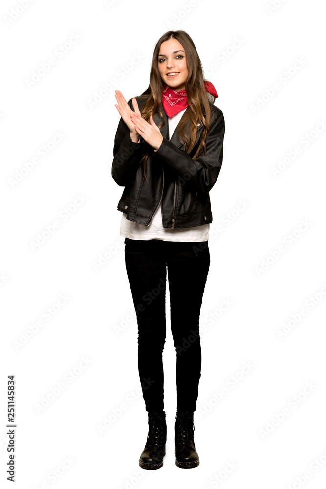 Full-length shot of Young woman with leather jacket applauding after presentation in a conference on isolated white background Full-length shot of Young woman with leather jacket applauding after presentation in a conference on isolated white background