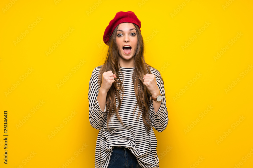 Girl with french style over yellow wall frustrated by a bad situation