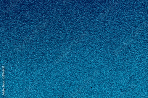 A close view of a shiny blue pattern material.