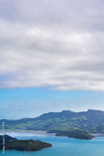 Mountain and bay in distance and sky covered with intense clouds © Przemyslaw Ziolek