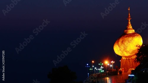 Time lapse Golden Rock, Kyaiktiyo Pagoda in Kyaikto, Myanmar night to day pan left to right photo