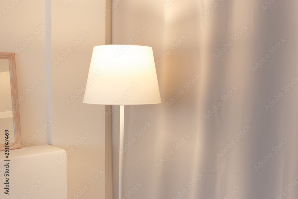 Soft colour room with floor lamp switched on Soft colour room with floor lamp switched on