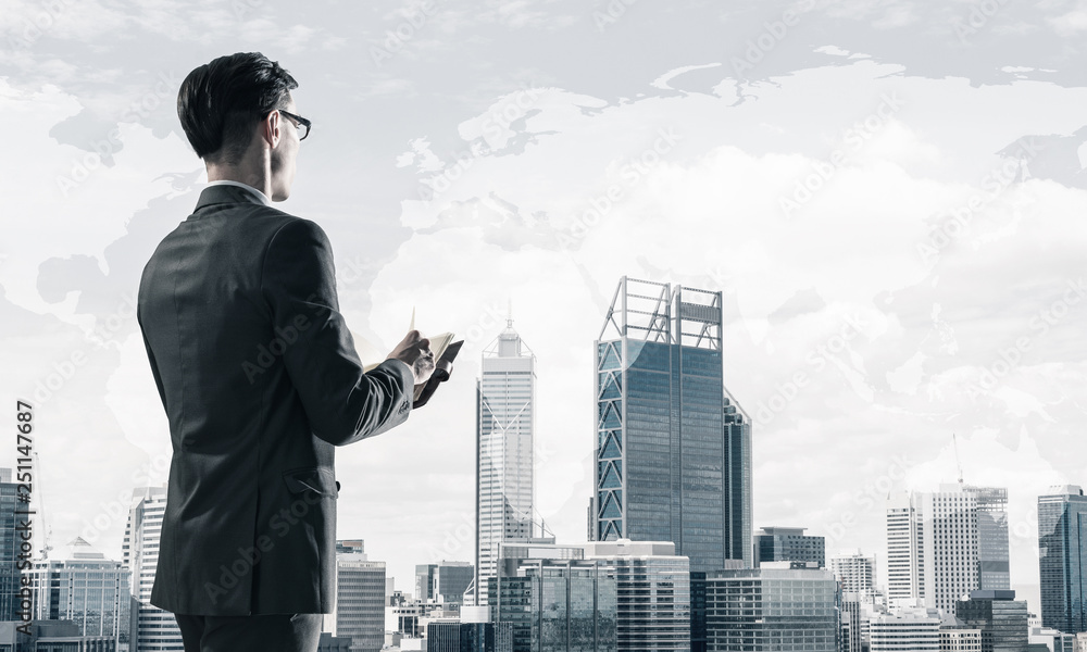 Concept of business success and control with confident boss against cityscape background Concept of business success and control with confident boss against cityscape background