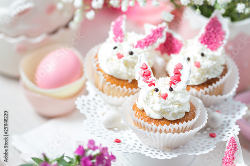 Bunny cupcakes on a white cake stand. Easter dessert