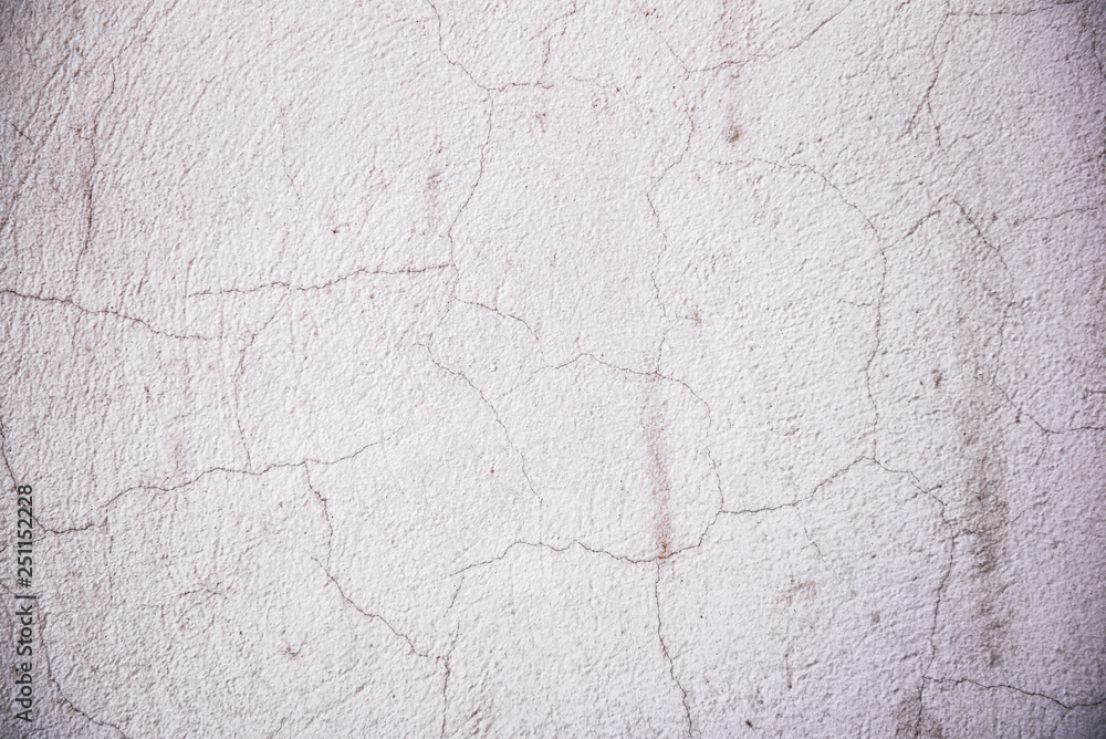 Texture of cement wall surface with cracked decorative plaster