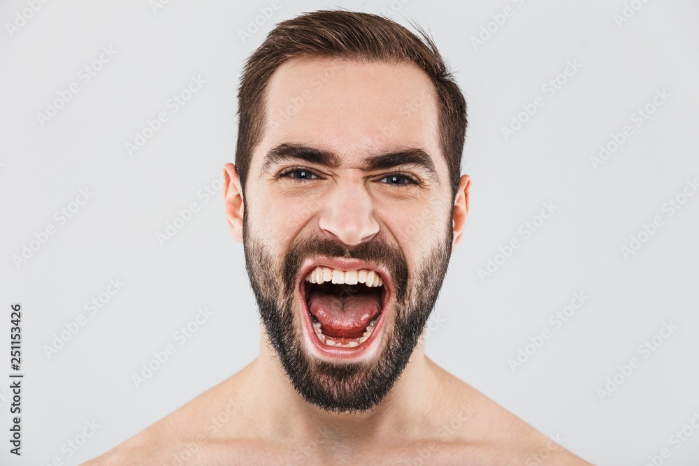 Close up of a young handsome bearded shirtless man Close up of a young handsome bearded shirtless man