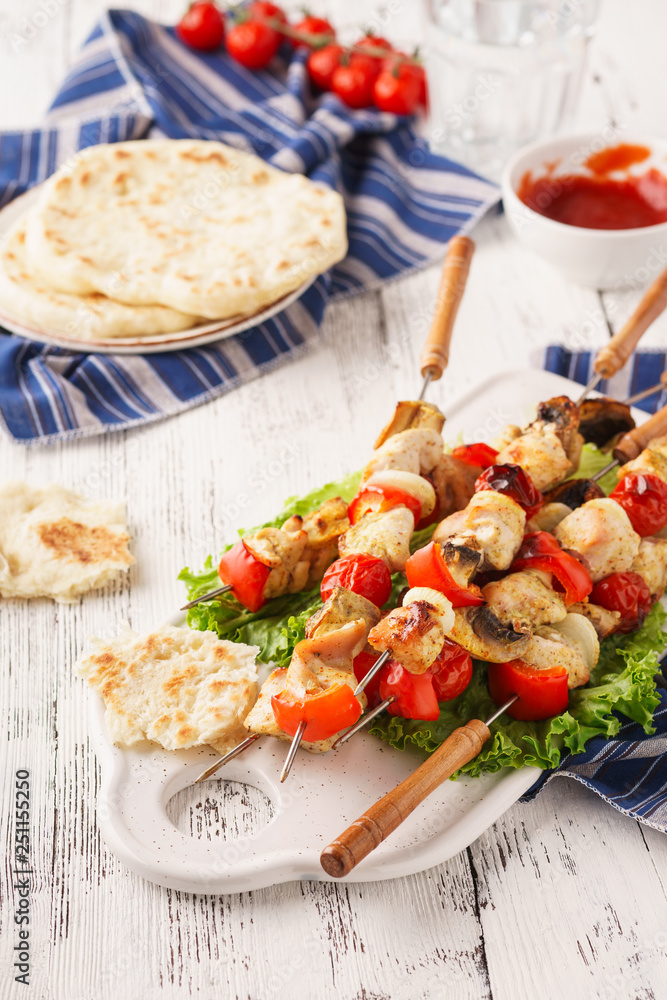 Homemade chicken shish kebab with mushrooms and bell peppers.