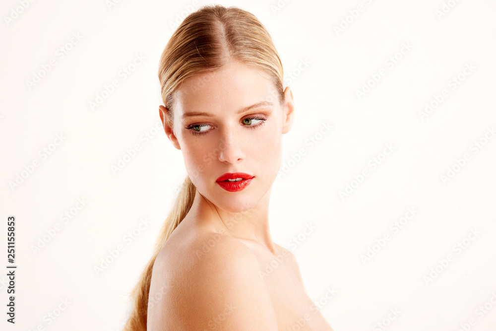 Portrait of attracive young woman face while standing at isolated white background Portrait of attracive young woman face while standing at isolated white background