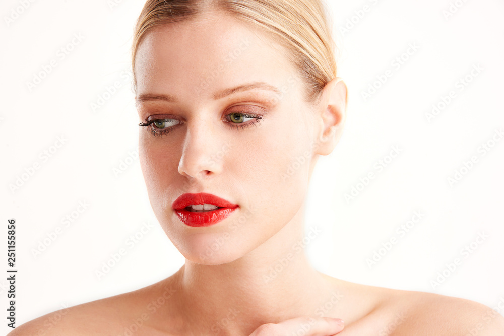 Portrait of attracive young woman face while standing at isolated white background Portrait of attracive young woman face while standing at isolated white background