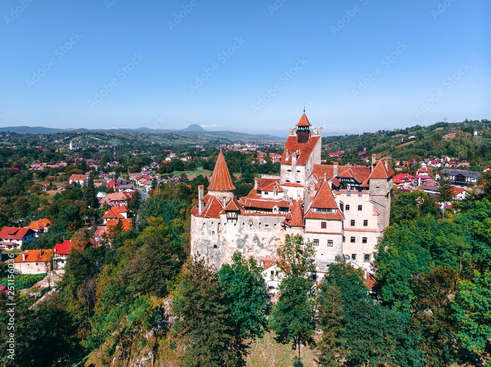 Beautiful Aerial panorama scenic view of medieval Dracula castle in Bran, Transylvania Romania, summer, autumn day. Tourism, travel, vacation concept Beautiful Aerial panorama scenic view of medieval Dracula castle in Bran, Transylvania Romania, summer, autumn day. Tourism, travel, vacation concept