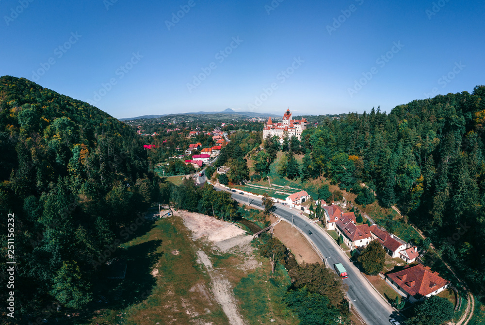 Beautiful Aerial panorama scenic view of medieval Dracula castle in Bran, Transylvania Romania, summer, autumn day. Tourism, travel, vacation concept, copy space