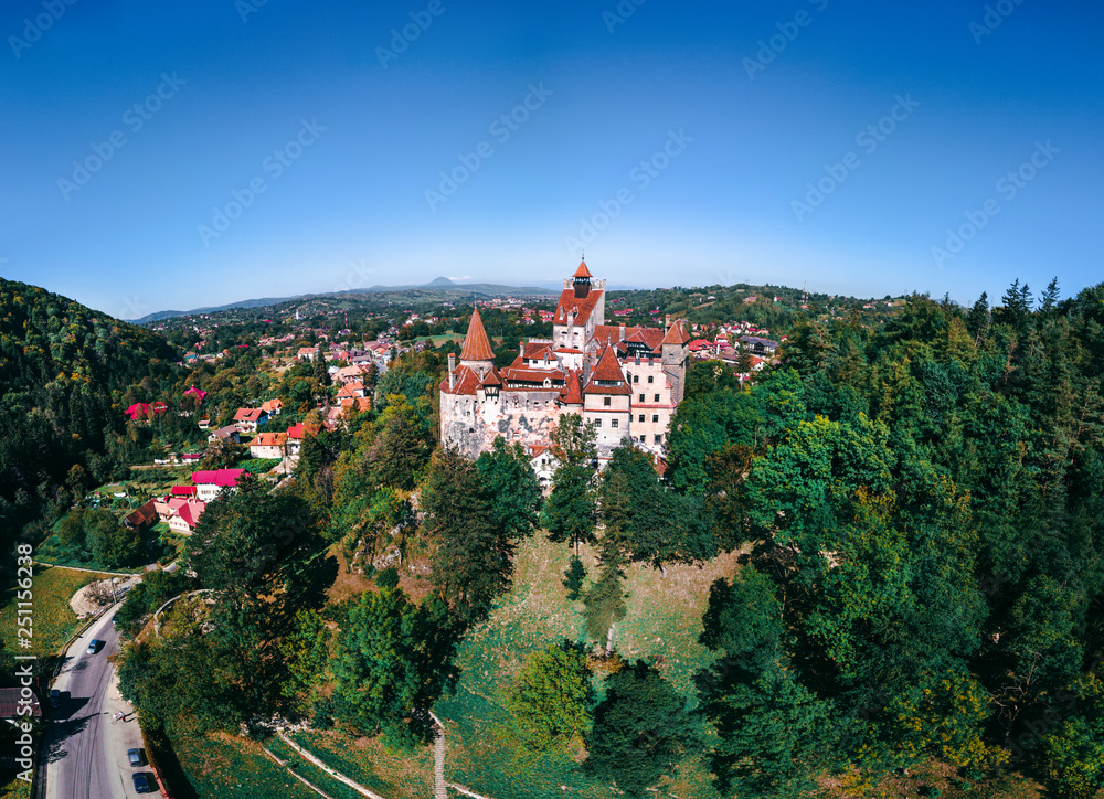 Beautiful Aerial panorama scenic view of medieval Dracula castle in Bran, Transylvania Romania, summer, autumn day. Tourism, travel, vacation concept, copy space