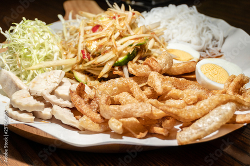 Papaya Spicy Salad with side dishes photo