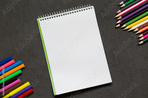 School notebook and various stationery. Back to school concept.