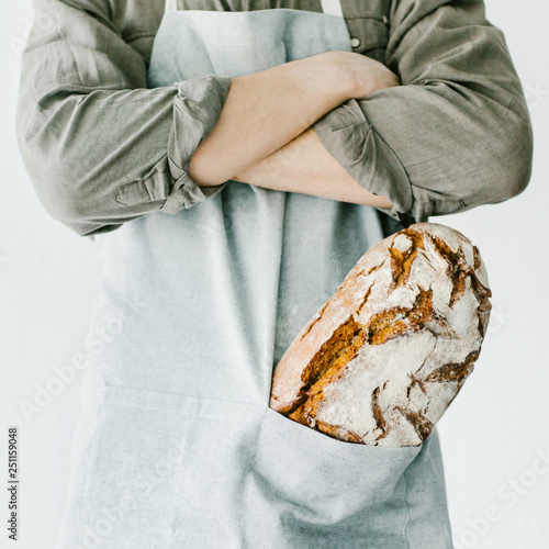 Baker or chef holding fresh made bread