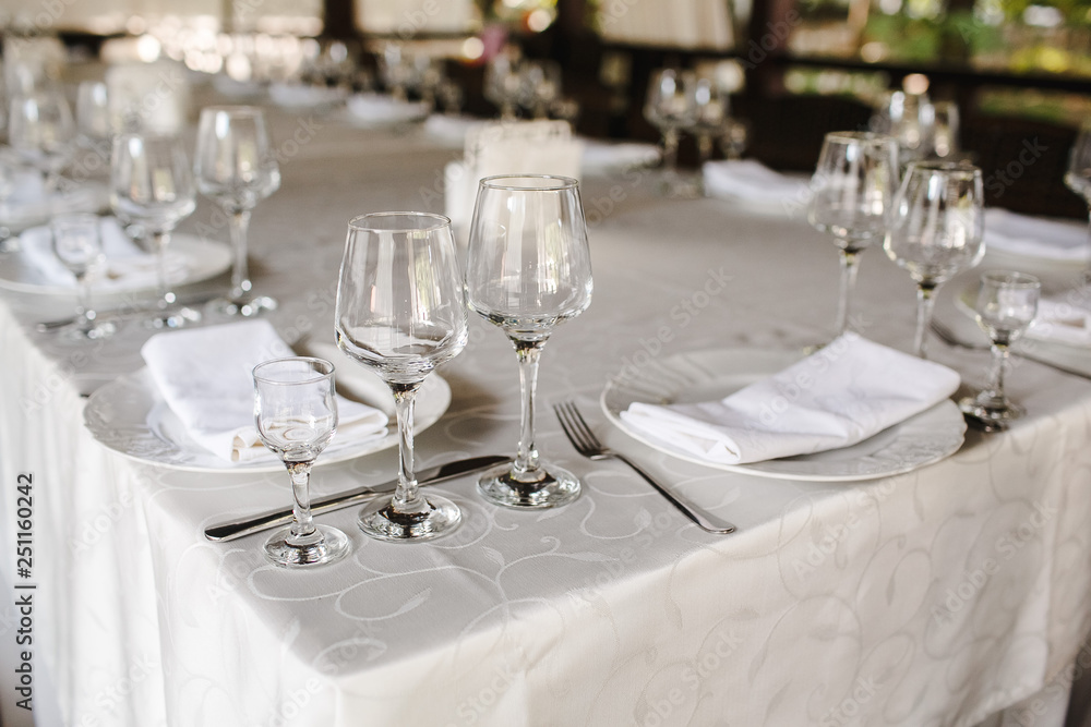 Crystal dishes on a restaurant table, open background. Crystal dishes on a restaurant table, open background.