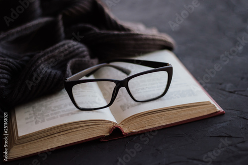 Glasses on the pages of an open book.
