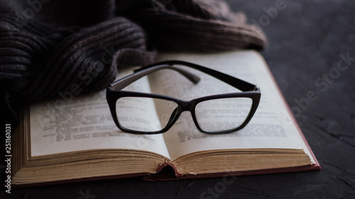 Glasses on the pages of an open book.