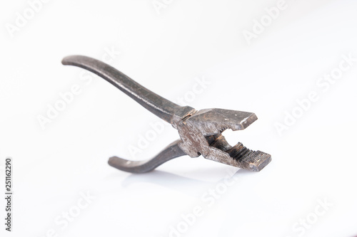 rusty pliers on white background