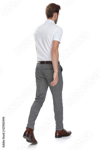 Fotografi side rear view of a  smart casual man  walking away