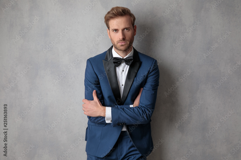 Well dressed man holding his hands crossed Well dressed man holding his hands crossed
