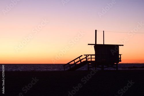 Sunset over USA Beach and Lifeguard Tower in Santa Monica, California