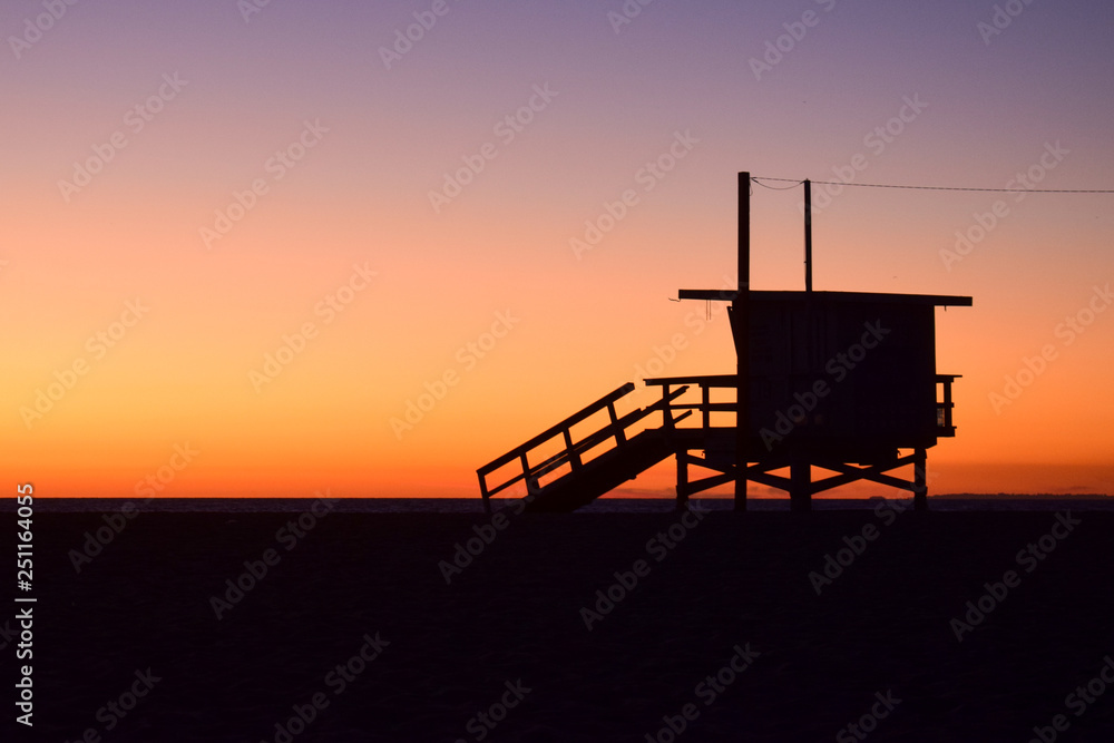 Sunset over USA Beach and Lifeguard Tower in Santa Monica, California