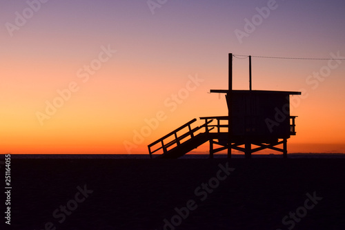 Sunset over USA Beach and Lifeguard Tower in Santa Monica, California
