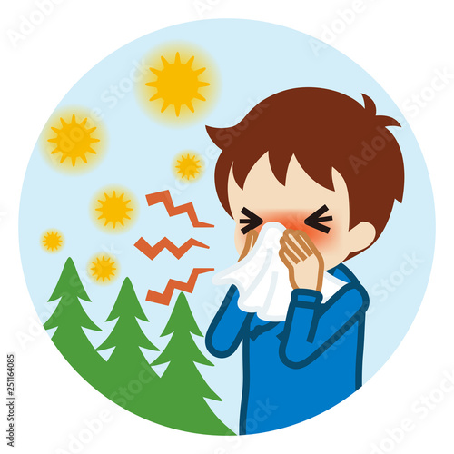 ティッシュで鼻をかむ男の子　屋外背景　円形 - 花粉症イメージ