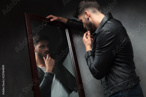 Canvas Print narcissist sexy young man admiring himself in the mirror