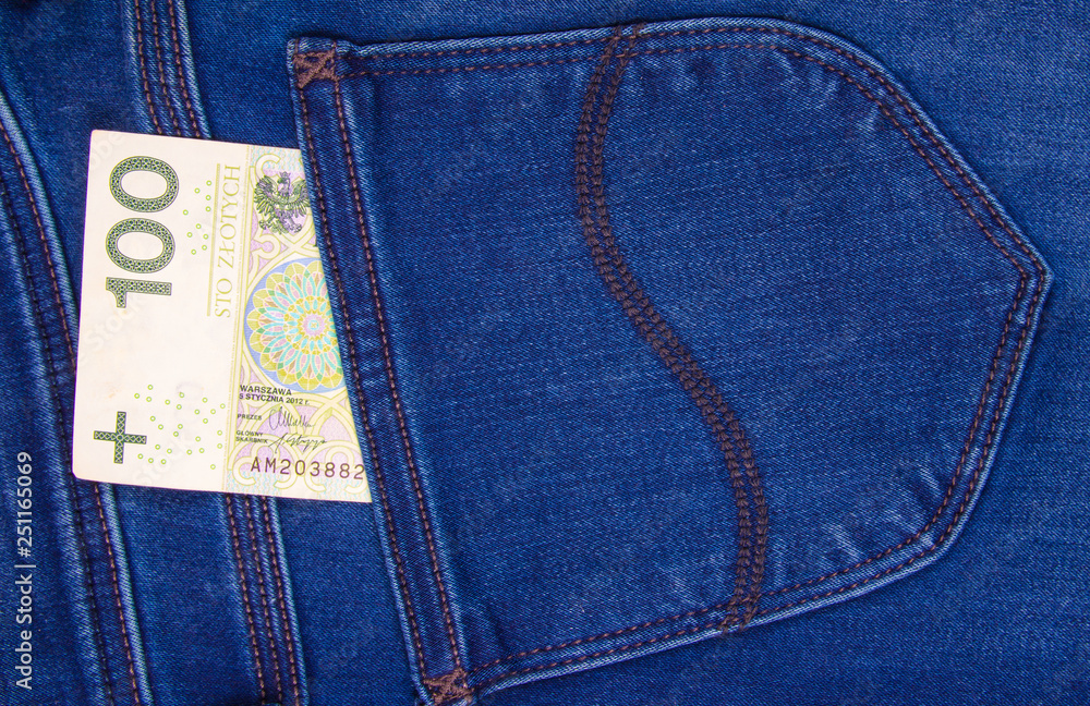 Polish banknotes in jeans pocket. CloseUp. Polish banknotes in jeans pocket. CloseUp.