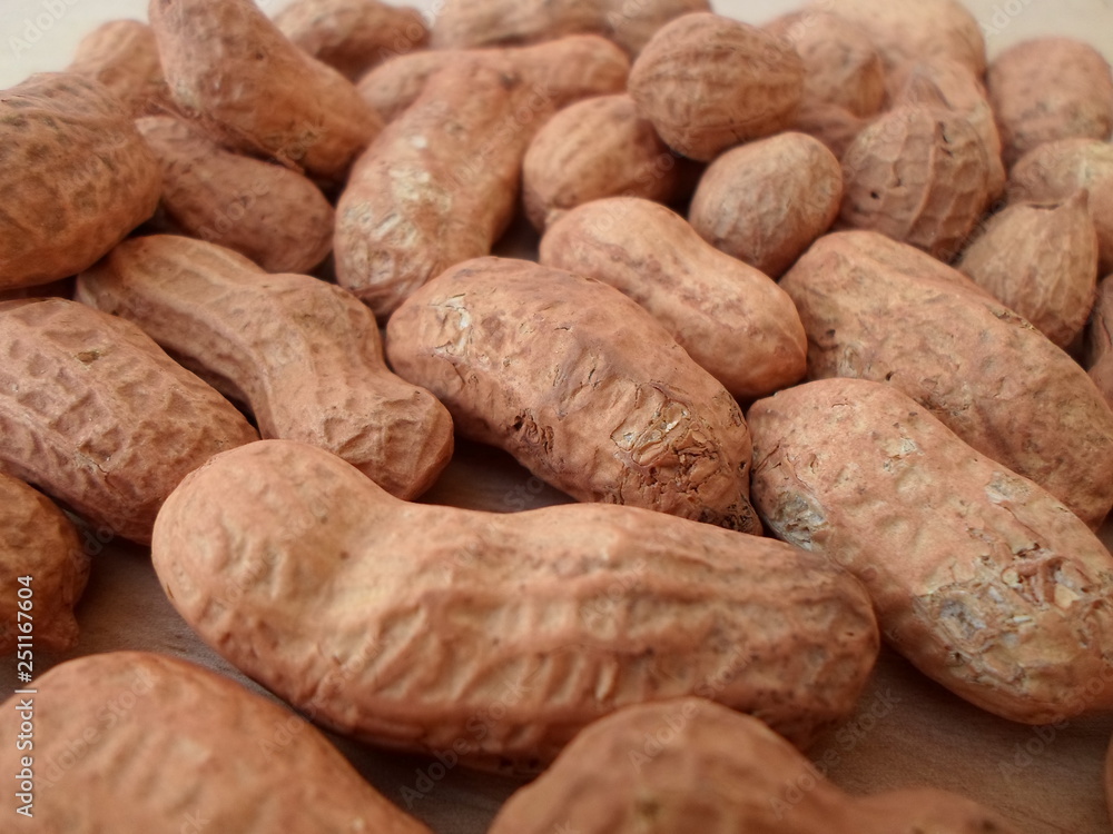 Peanuts On Wooden Board Peanuts On Wooden Board