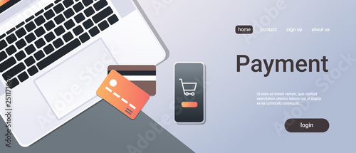 online shopping mobile application internet payment concept top angle view desktop smartphone laptop screen credit card office stuff horizontal copy space