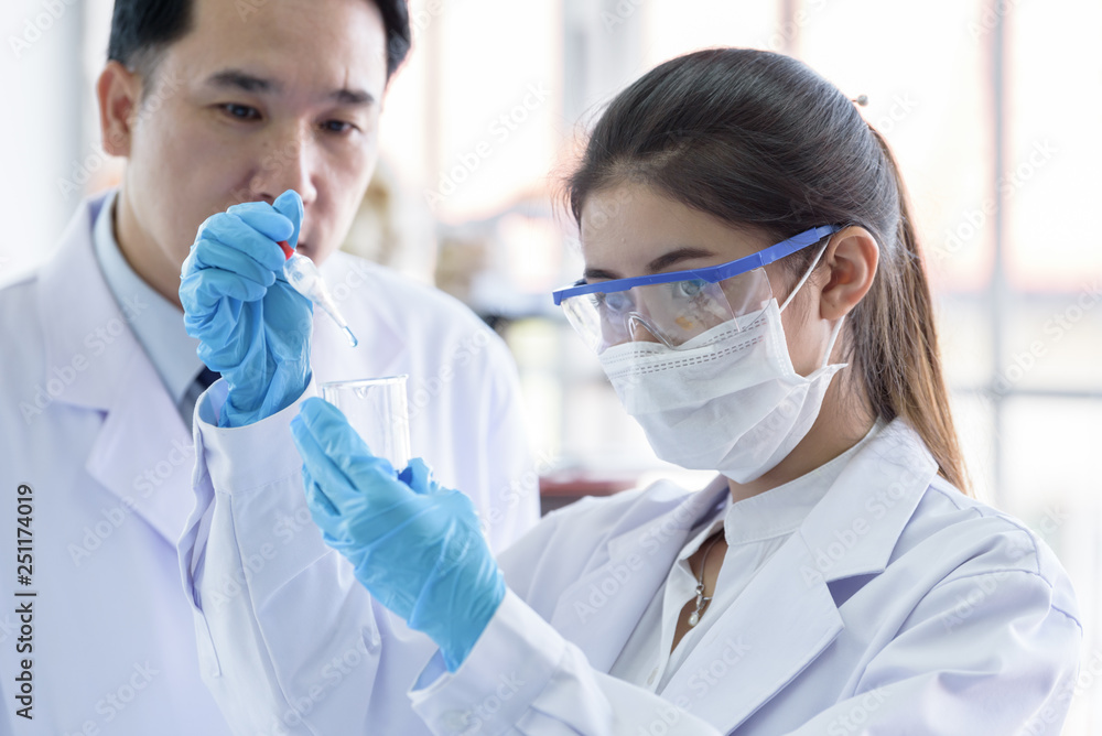 Asian scientist team has researching in laboratory. Asian scientist team has researching in laboratory.